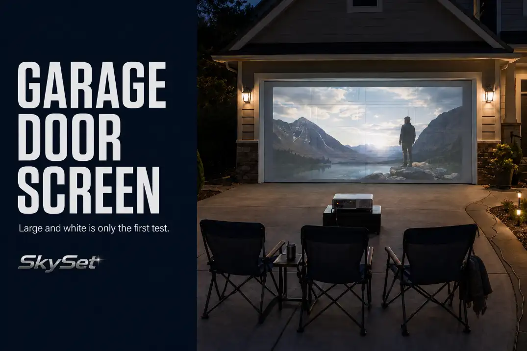 Outdoor movie projected onto a sectional garage door with visible panel lines and centered driveway seating.