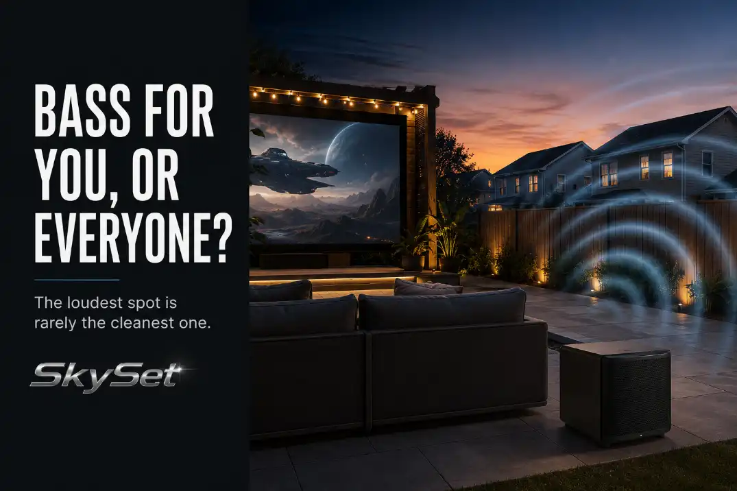 Outdoor subwoofer placement for backyard movies showing bass support near seating and spill risk toward a neighbor fence.